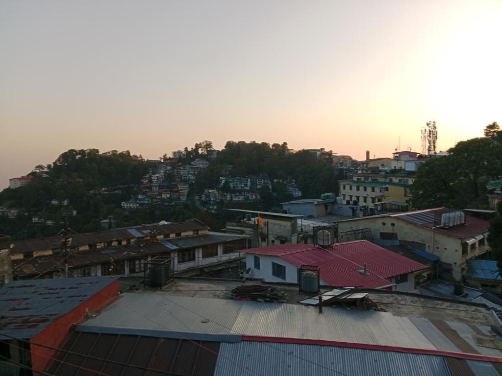 an aerial view of a city with buildings at Landour Apartment Beauty and Charm Kothri- Summer n Snow in Mussoorie