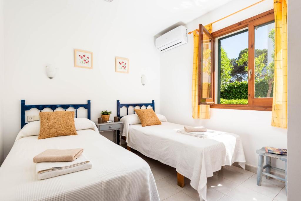 Postel nebo postele na pokoji v ubytování Villa Vista Alegre - Cala Galdana