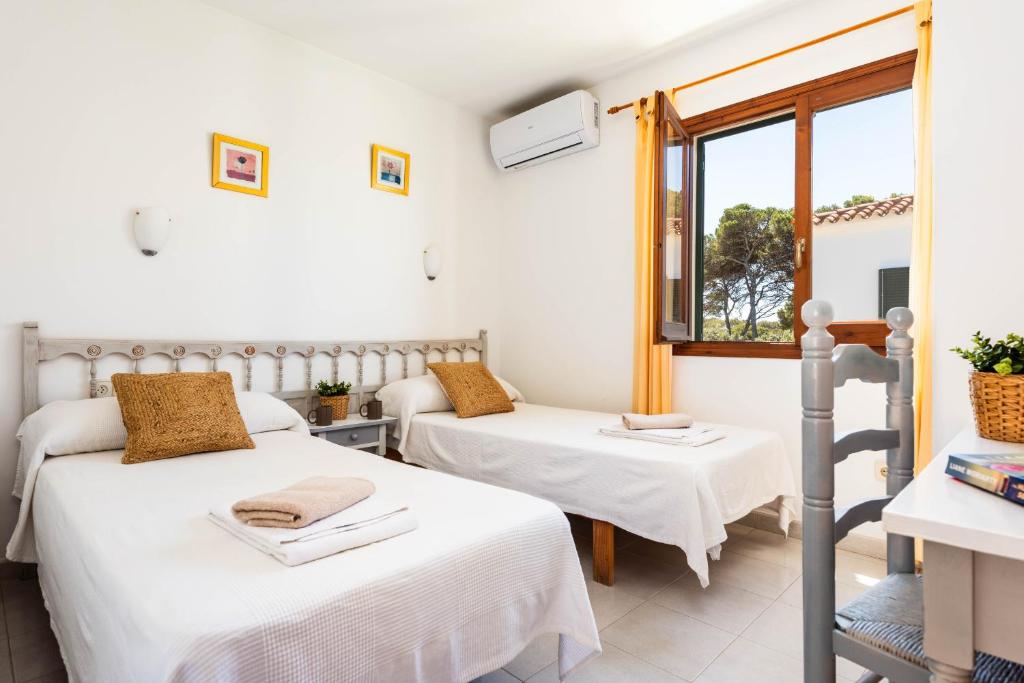 Postel nebo postele na pokoji v ubytování Villa Vista Alegre - Cala Galdana