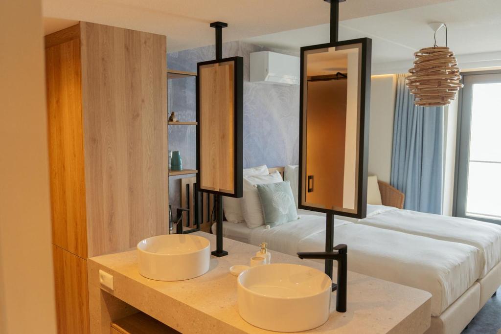 Postel nebo postele na pokoji v ubytování Beachfront Boutiquehotel