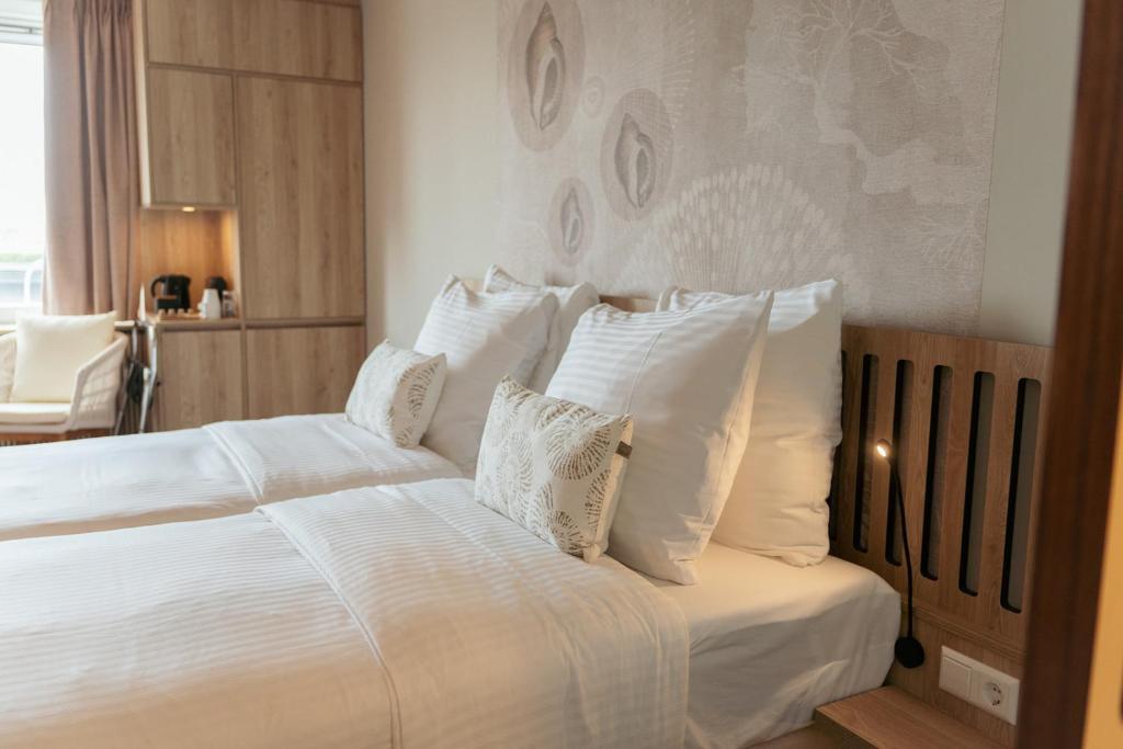Postel nebo postele na pokoji v ubytování Beachfront Boutiquehotel