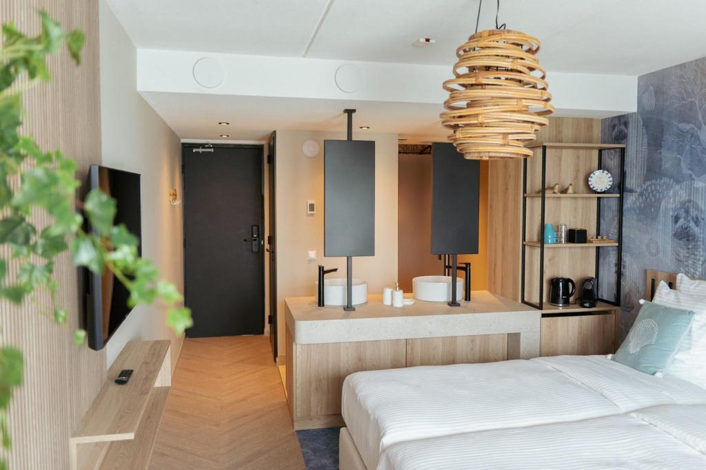 Postel nebo postele na pokoji v ubytování Beachfront Boutiquehotel