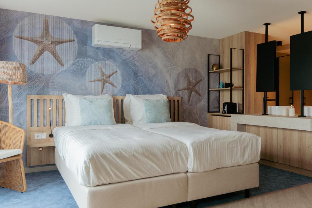 Postel nebo postele na pokoji v ubytování Beachfront Boutiquehotel