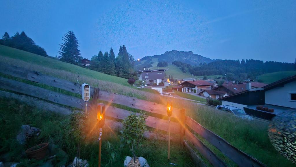 a train traveling down the tracks in a village at Jungholz Erlebnis in Jungholz