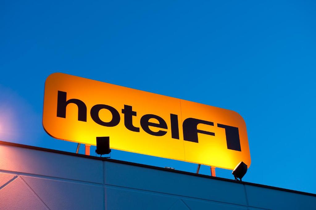 a hotel sign on top of a building at hotelF1 Strasbourg Sud Illkirch in Geispolsheim