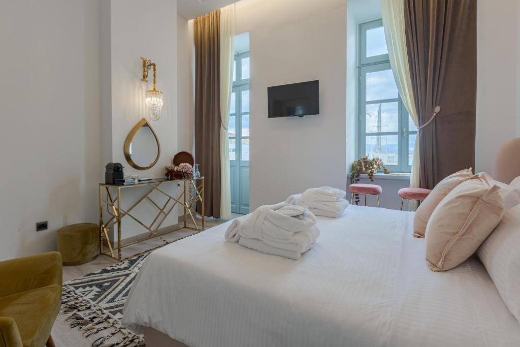 Postel nebo postele na pokoji v ubytování Residenza di Fedralia