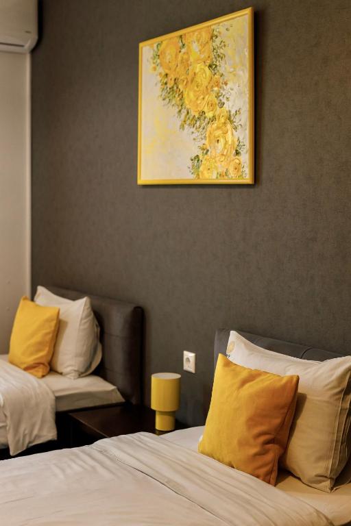 Postel nebo postele na pokoji v ubytování Sunny Hotel