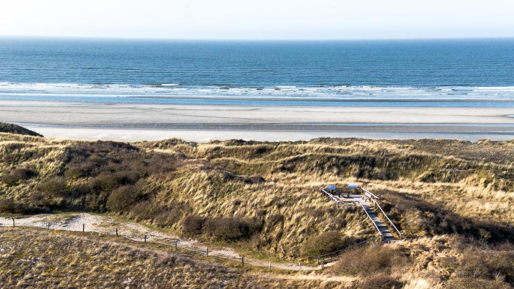 an aerial view of a beach and the ocean at Hotel Atlantic Juist in Juist