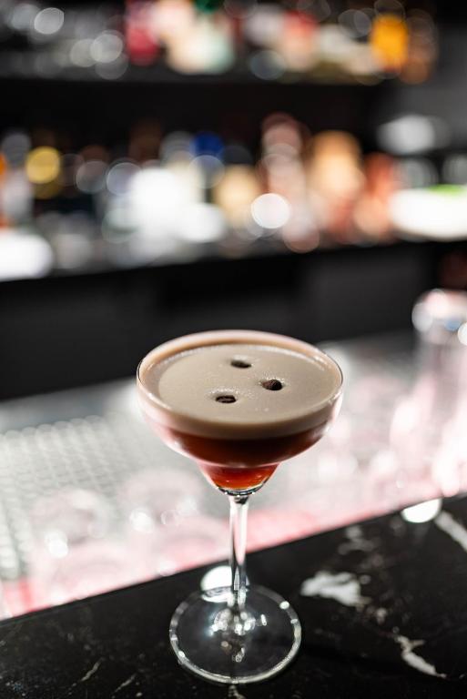 a cocktail glass sitting on top of a counter at Hotel Atlantic Juist in Juist