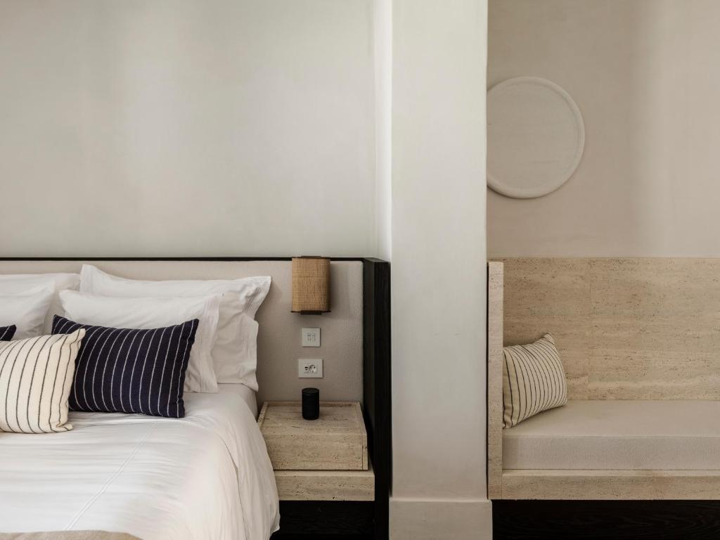 Postel nebo postele na pokoji v ubytování Anandes Hotel