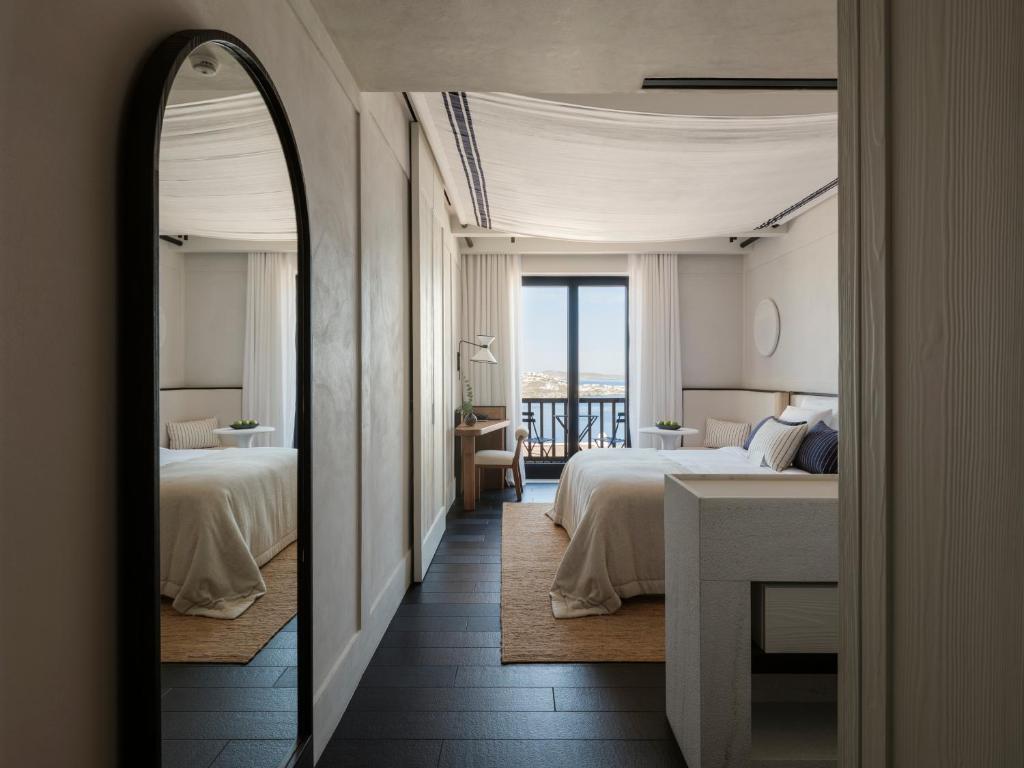 Postel nebo postele na pokoji v ubytování Anandes Hotel