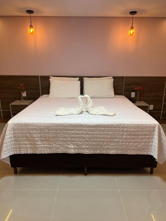 Postel nebo postele na pokoji v ubytování Hotel Absolar