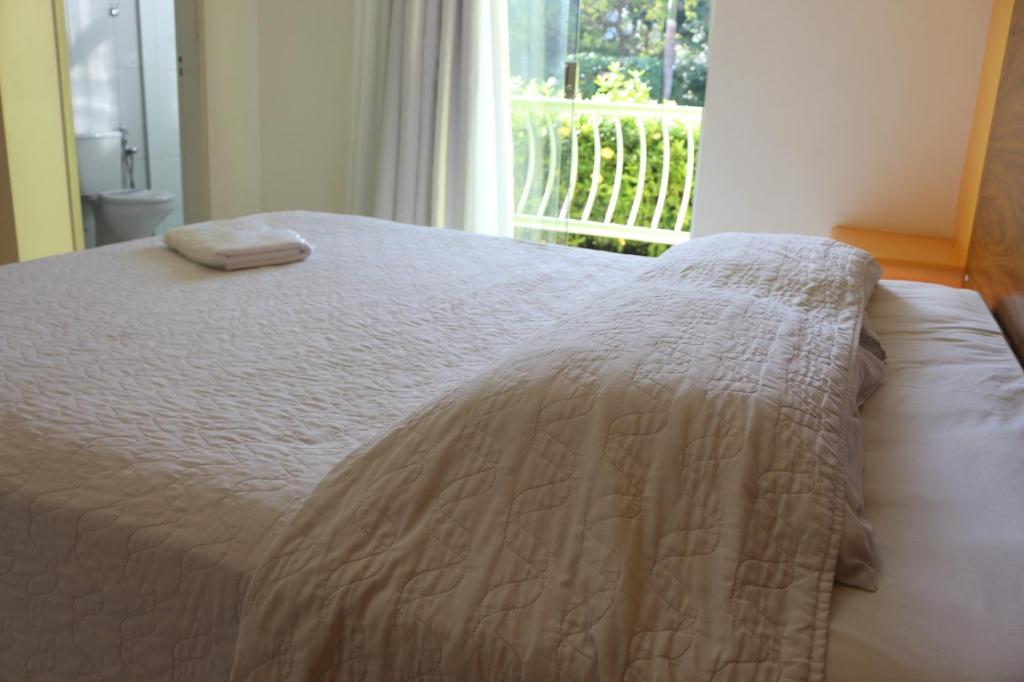 Postel nebo postele na pokoji v ubytování Hotel Absolar