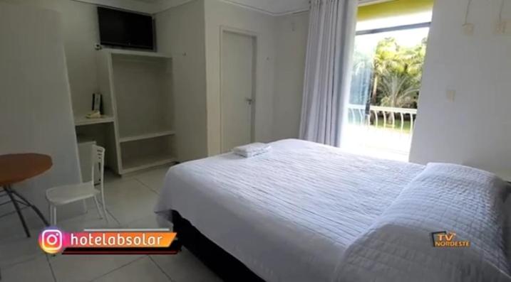 Postel nebo postele na pokoji v ubytování Hotel Absolar