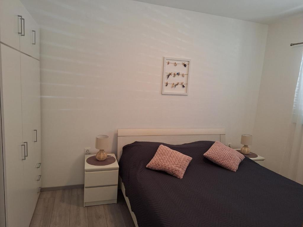 Postel nebo postele na pokoji v ubytování Apartments Marija