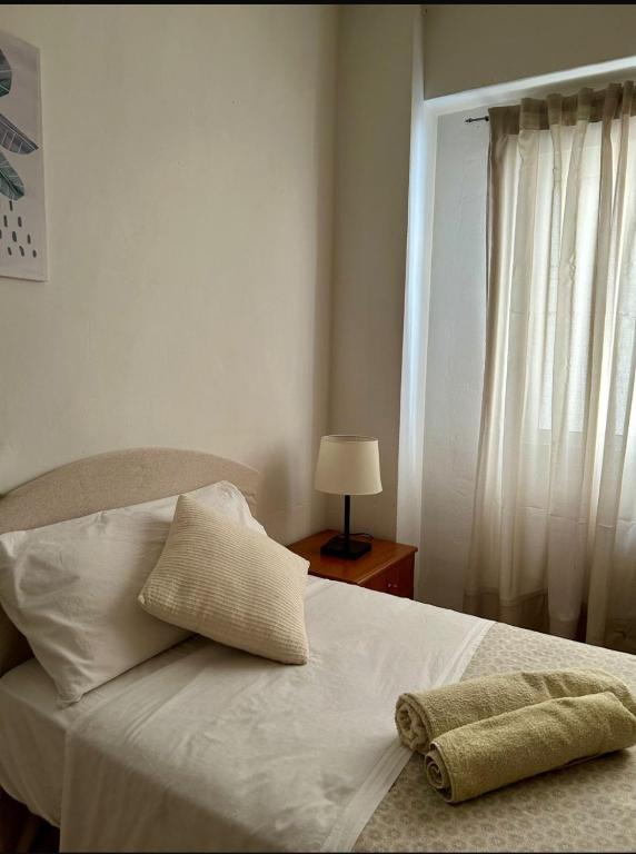 A bed or beds in a room at Warm Welcome