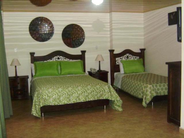 Postel nebo postele na pokoji v ubytování Hoteles Bogotá Inn La Soledad