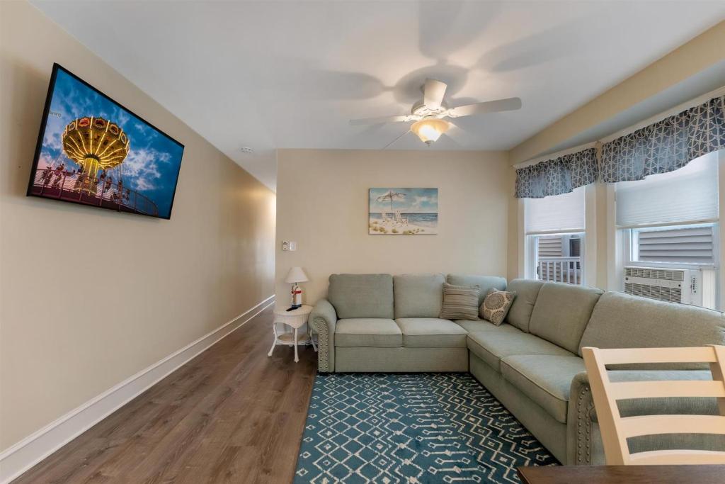 a living room with a couch and a ceiling fan at 5605 Seaview Ave, Unit G in Wildwood