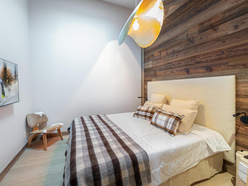 Łóżko lub łóżka w pokoju w obiekcie Duplex avec espace détente, piscine et 4 chambres à Megève - FR-1-569-66