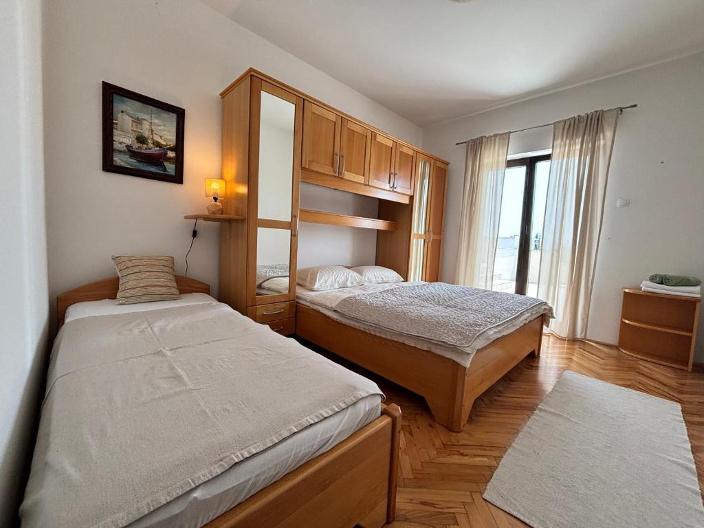 Posteľ alebo postele v izbe v ubytovaní Apartments Hrusta