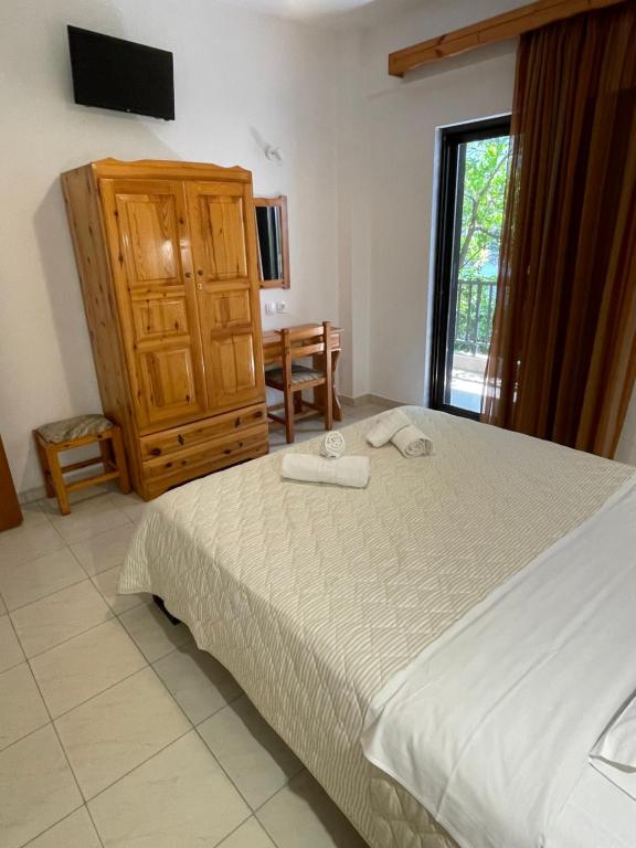 Postel nebo postele na pokoji v ubytování Manos Kritikakis Apartments