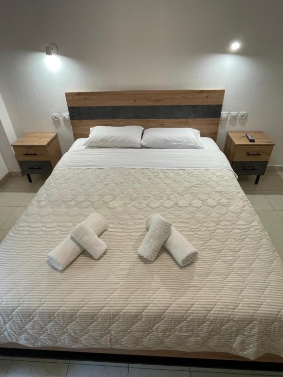 Postel nebo postele na pokoji v ubytování Manos Kritikakis Apartments
