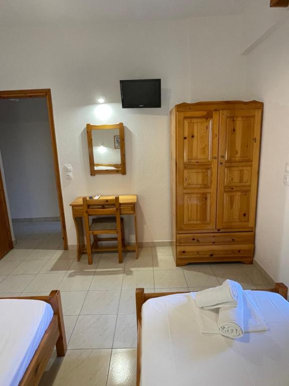 Postel nebo postele na pokoji v ubytování Manos Kritikakis Apartments