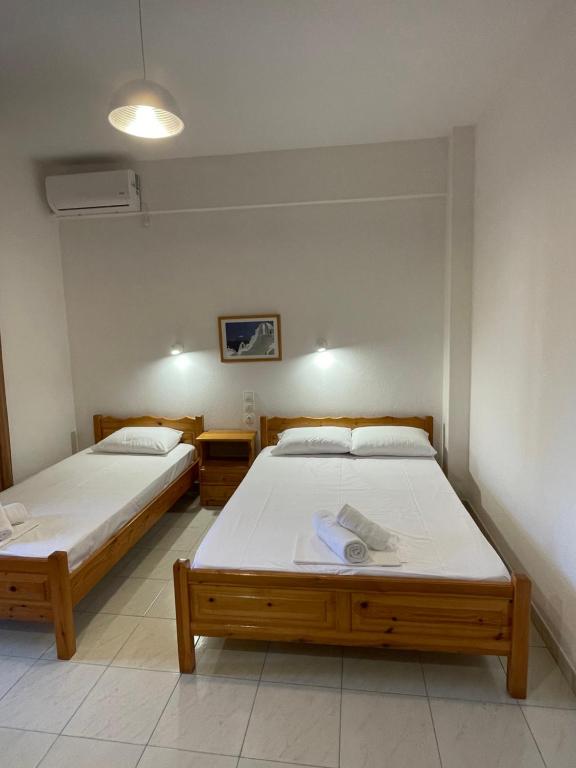 Postel nebo postele na pokoji v ubytování Manos Kritikakis Apartments