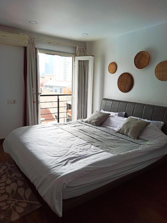 Postel nebo postele na pokoji v ubytování Cassia Riverside Villa