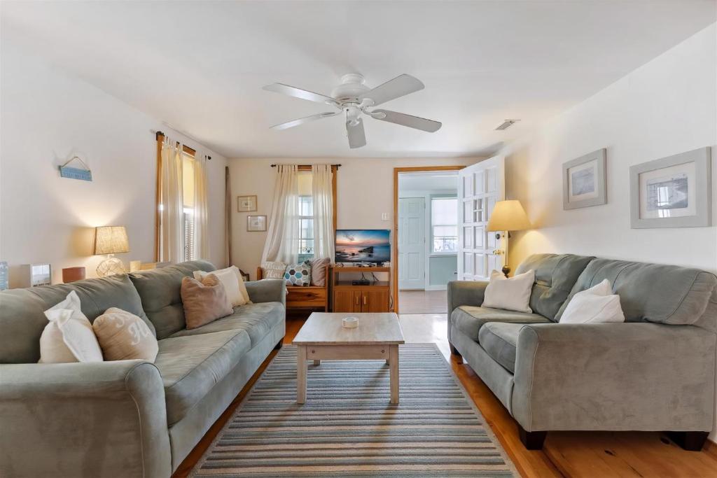 a living room with two couches and a table at 234 W 1St Ave in North Wildwood