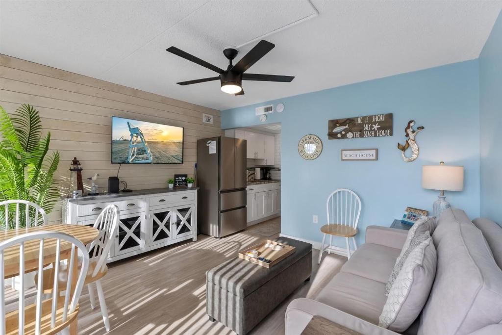 a living room with a couch and a kitchen at 301 Ocean Ave, Unit 102 - The Harbor Light in North Wildwood