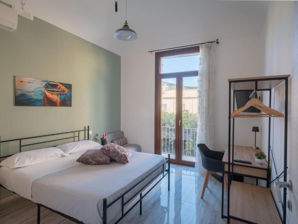 Postel nebo postele na pokoji v ubytování Agorà di Favignana