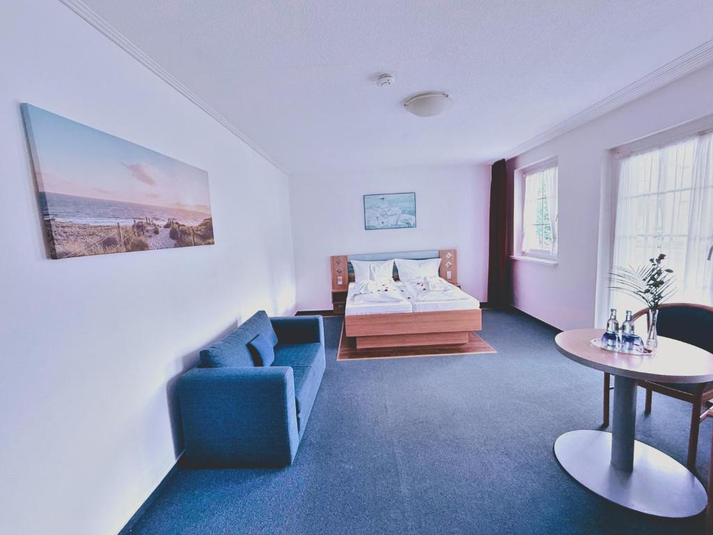 Postel nebo postele na pokoji v ubytování Hotel Granitz