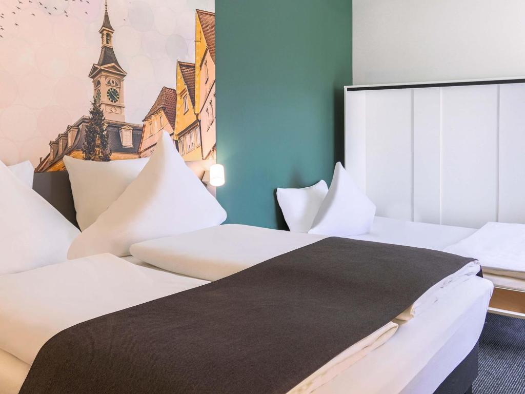 Postel nebo postele na pokoji v ubytování B&B Hotel Aalen