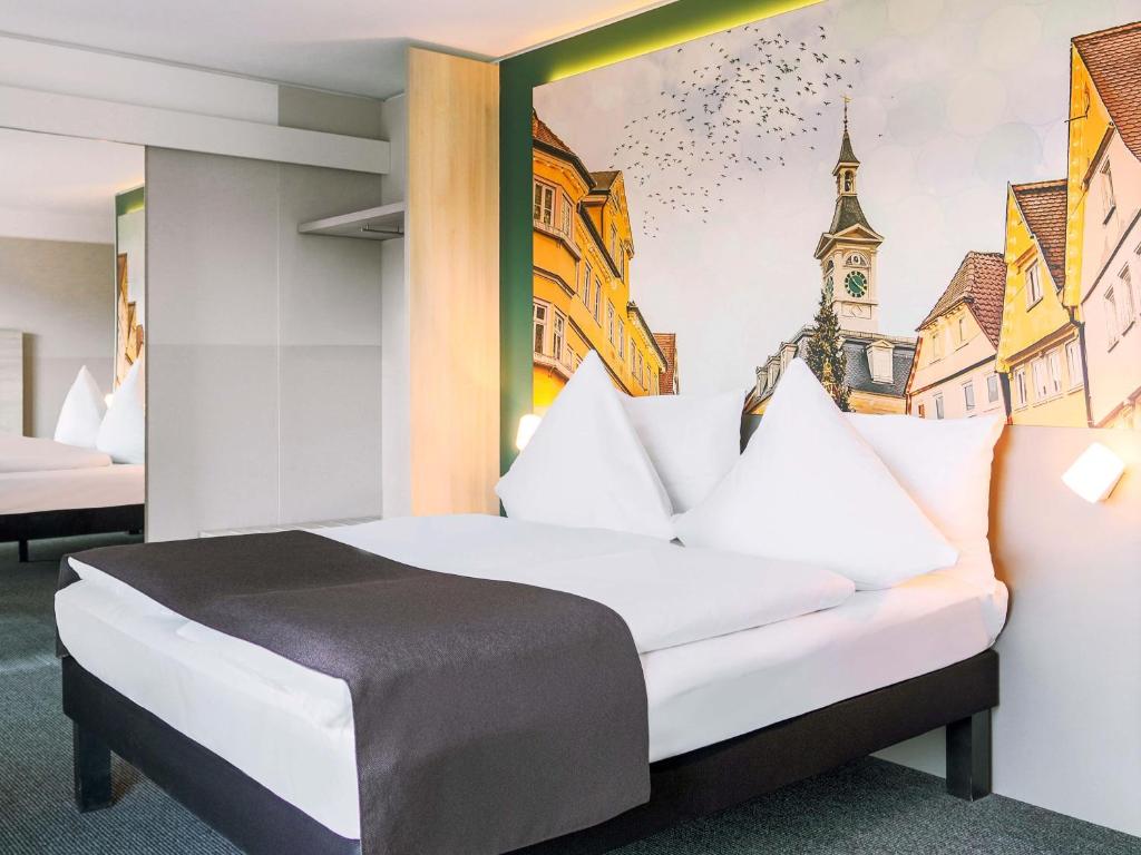 Postel nebo postele na pokoji v ubytování B&B Hotel Aalen