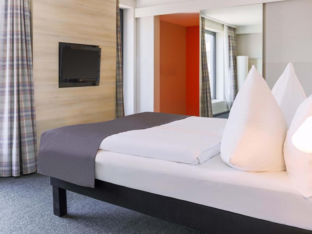 Postel nebo postele na pokoji v ubytování B&B Hotel Aalen