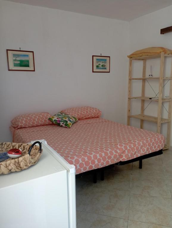 Postel nebo postele na pokoji v ubytování Stanze nel verde
