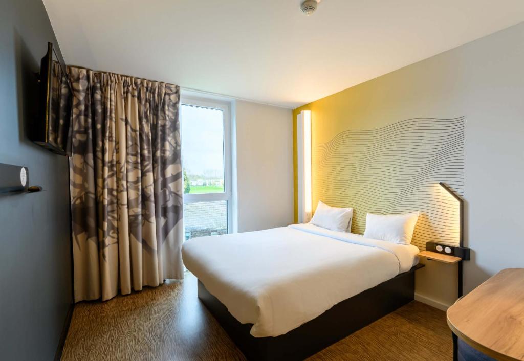 Postel nebo postele na pokoji v ubytování B&B HOTEL Compiègne