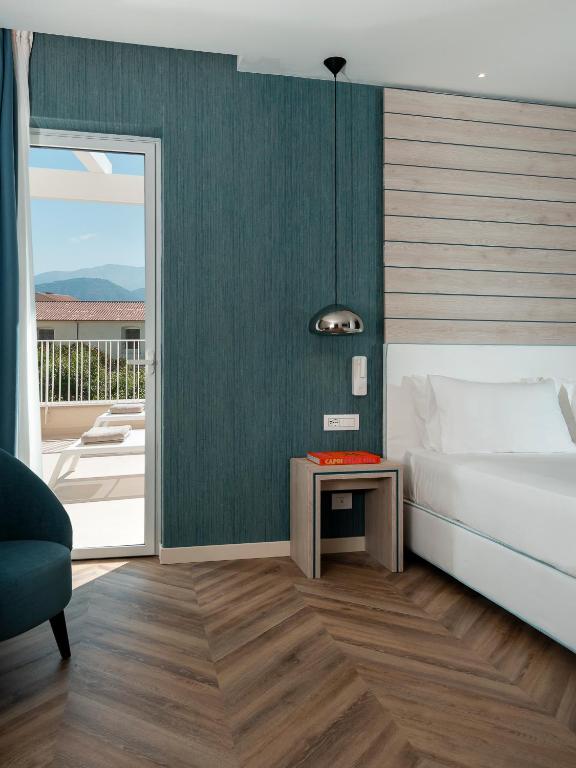 Postel nebo postele na pokoji v ubytování Hotel Tirrenia