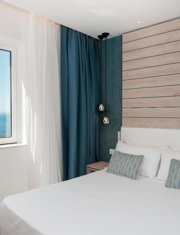 Postel nebo postele na pokoji v ubytování Hotel Tirrenia
