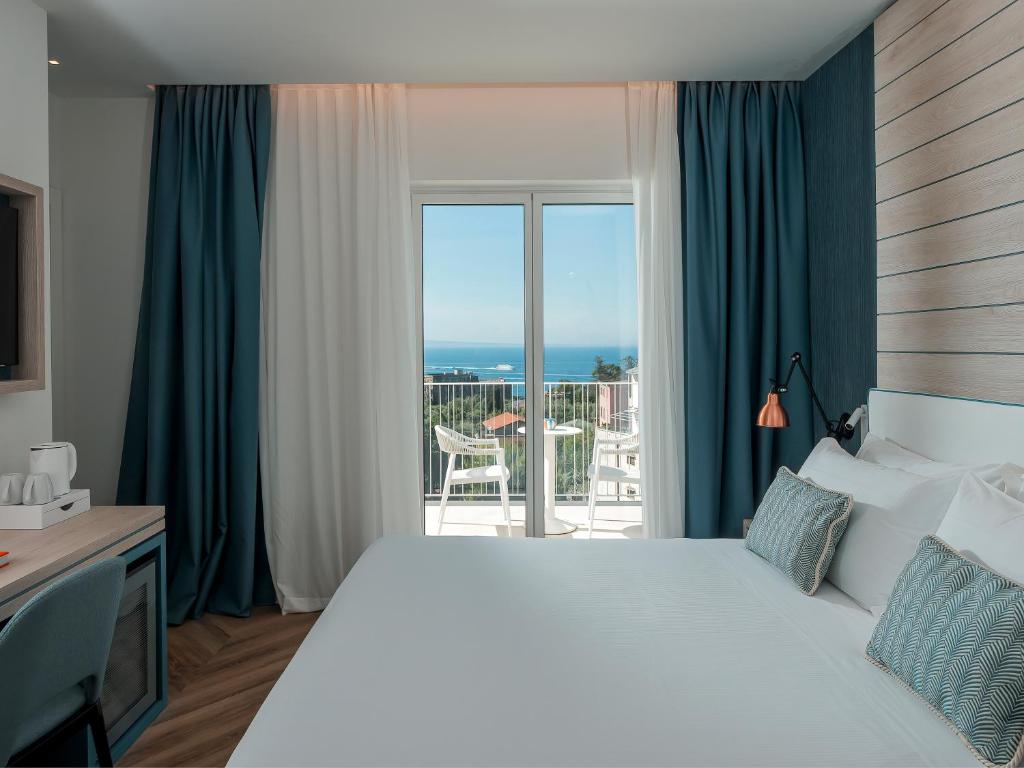 Postel nebo postele na pokoji v ubytování Hotel Tirrenia