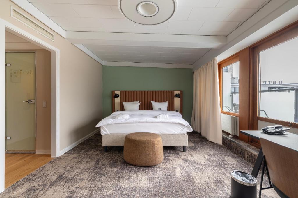 Postel nebo postele na pokoji v ubytování Imperial Hotel