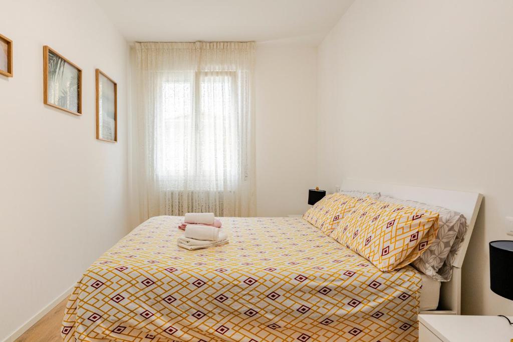 Giường trong phòng chung tại Vittoria Living Studio