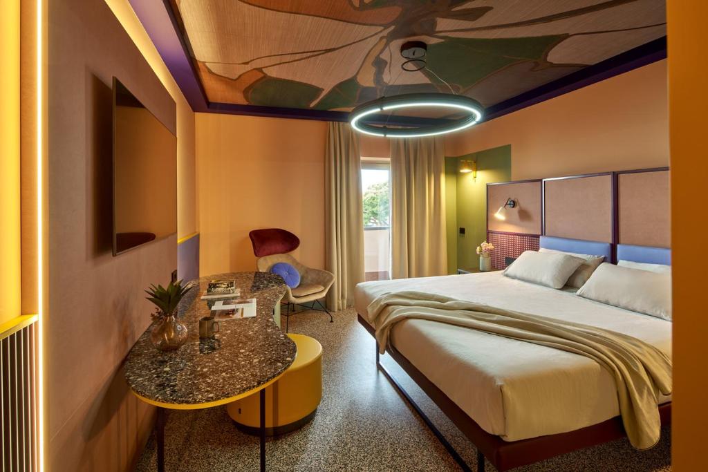 En eller flere senge i et værelse på Residence Lido Hotel