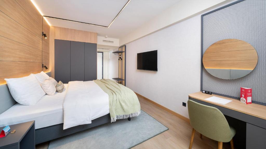 TV a/nebo společenská místnost v ubytování Hotel Pelegrin Plava Laguna