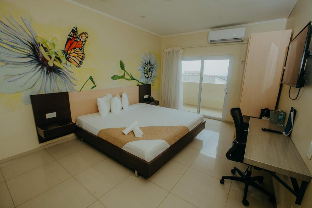 Postel nebo postele na pokoji v ubytování Curacao Airport Hotel
