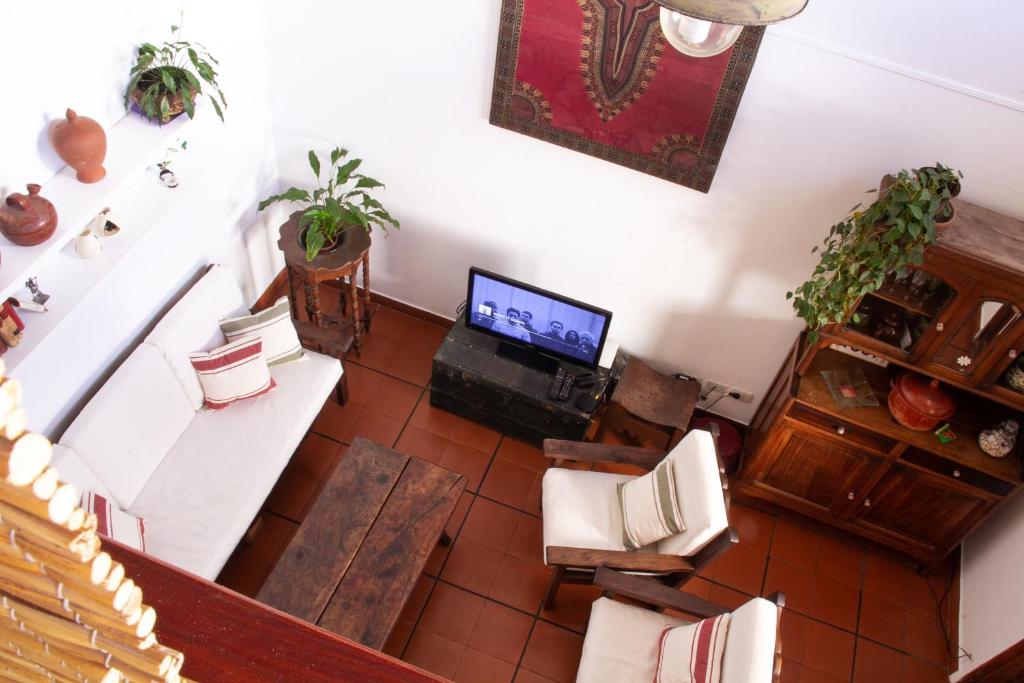 Μια τηλεόραση ή/και κέντρο ψυχαγωγίας στο Loft PH, con patio