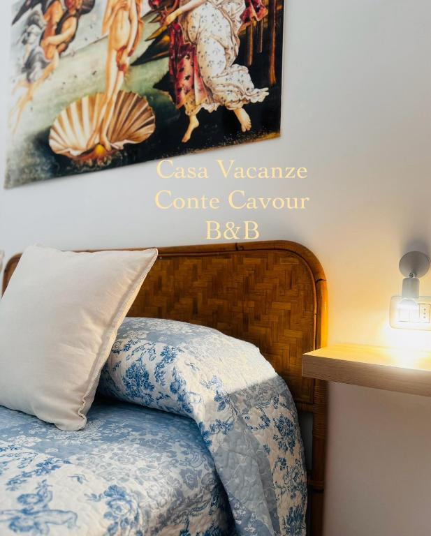 Postel nebo postele na pokoji v ubytování Conte Cavour B&B