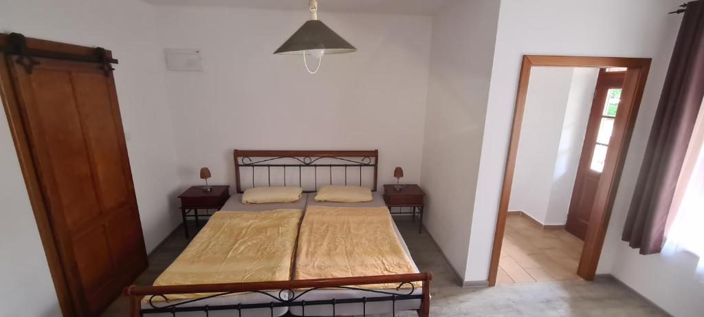 Postel nebo postele na pokoji v ubytování Apartmány Bardi