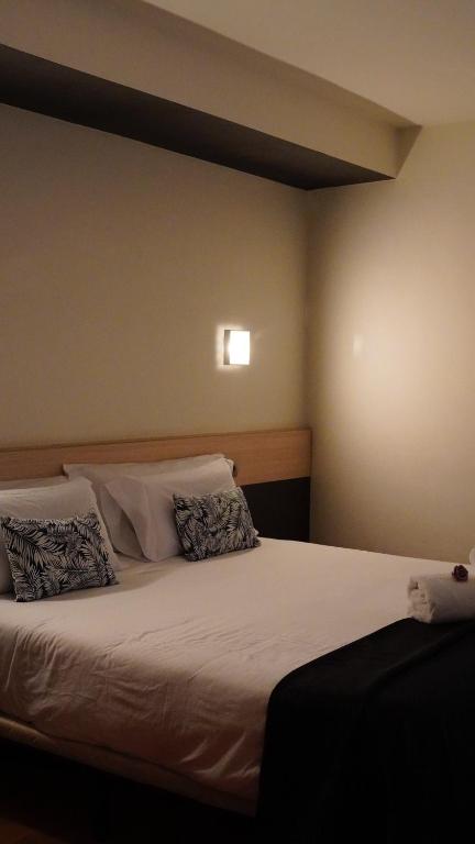 Postel nebo postele na pokoji v ubytování Hotel Marisqueria Cal Tet